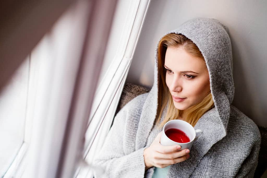 Woman looking out window