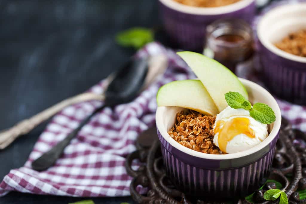 Apple crumble dessert with vanilla ice cream