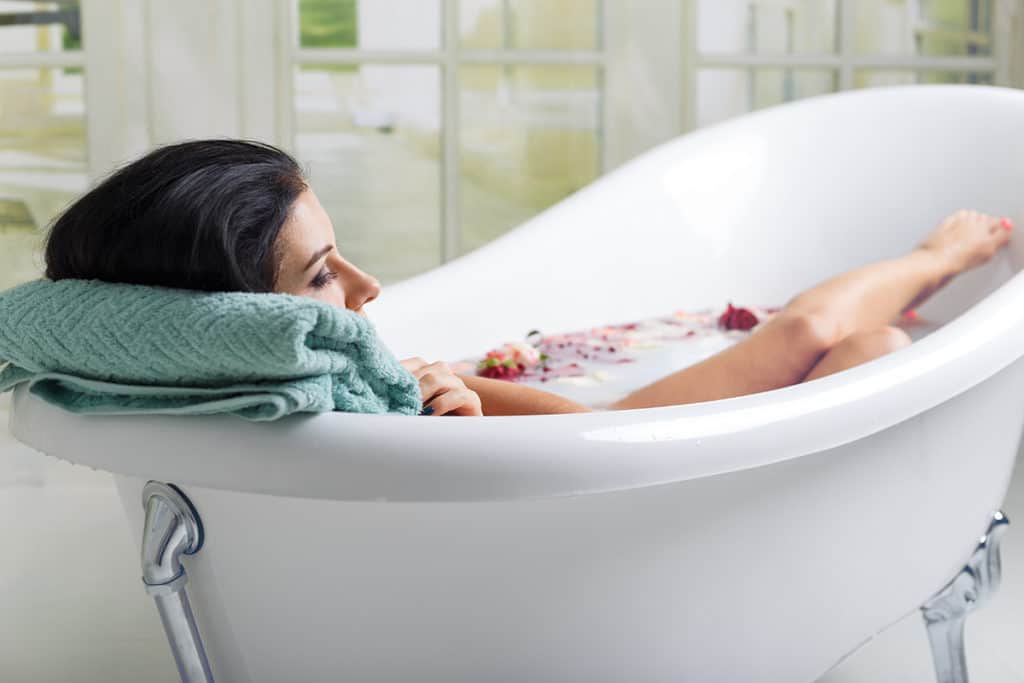 Woman taking bath for skin